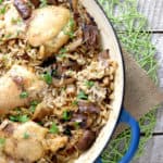 overhead of wood table and loose mushrooms and parsley with clear photo of rice with mushroom and chicken